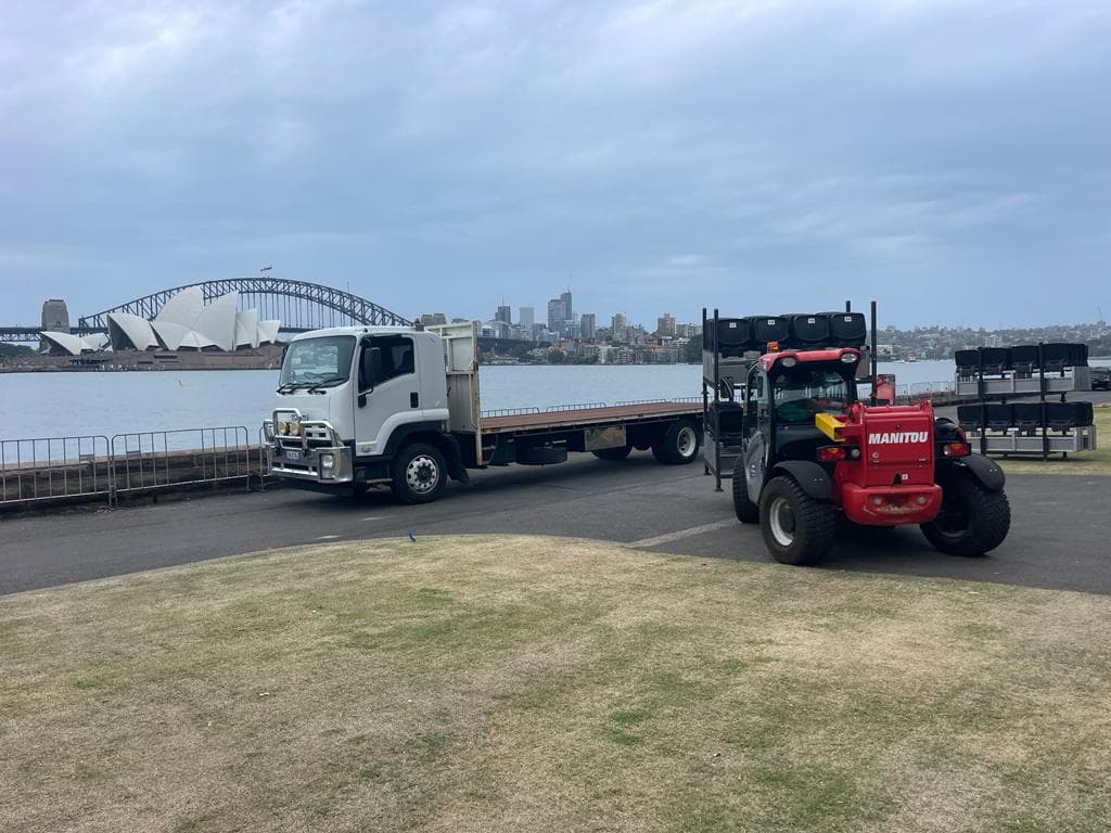 Quick Cargo flat-top truck and forklift by the Sydney Harbour Bridge