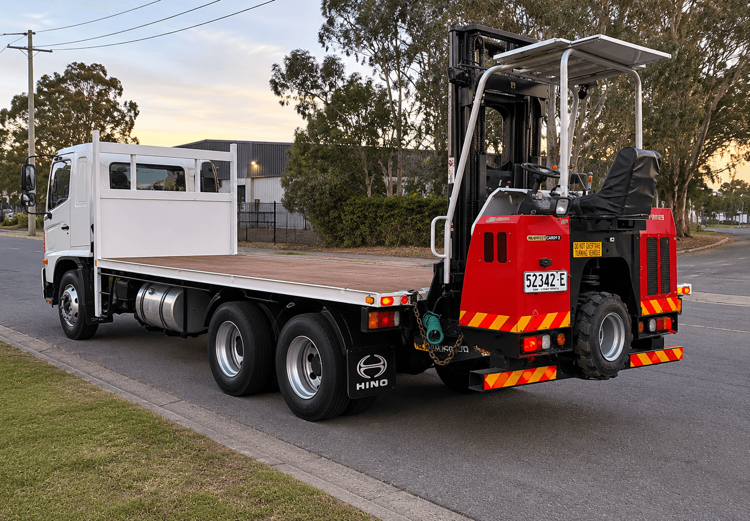 Moffett forklift working on rough, uneven ground at a site