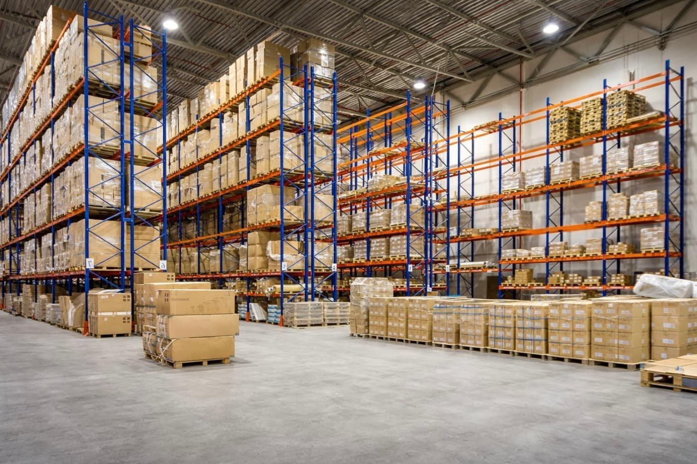 Pallet racking stacked with palletised stock inside a distribution warehouse
