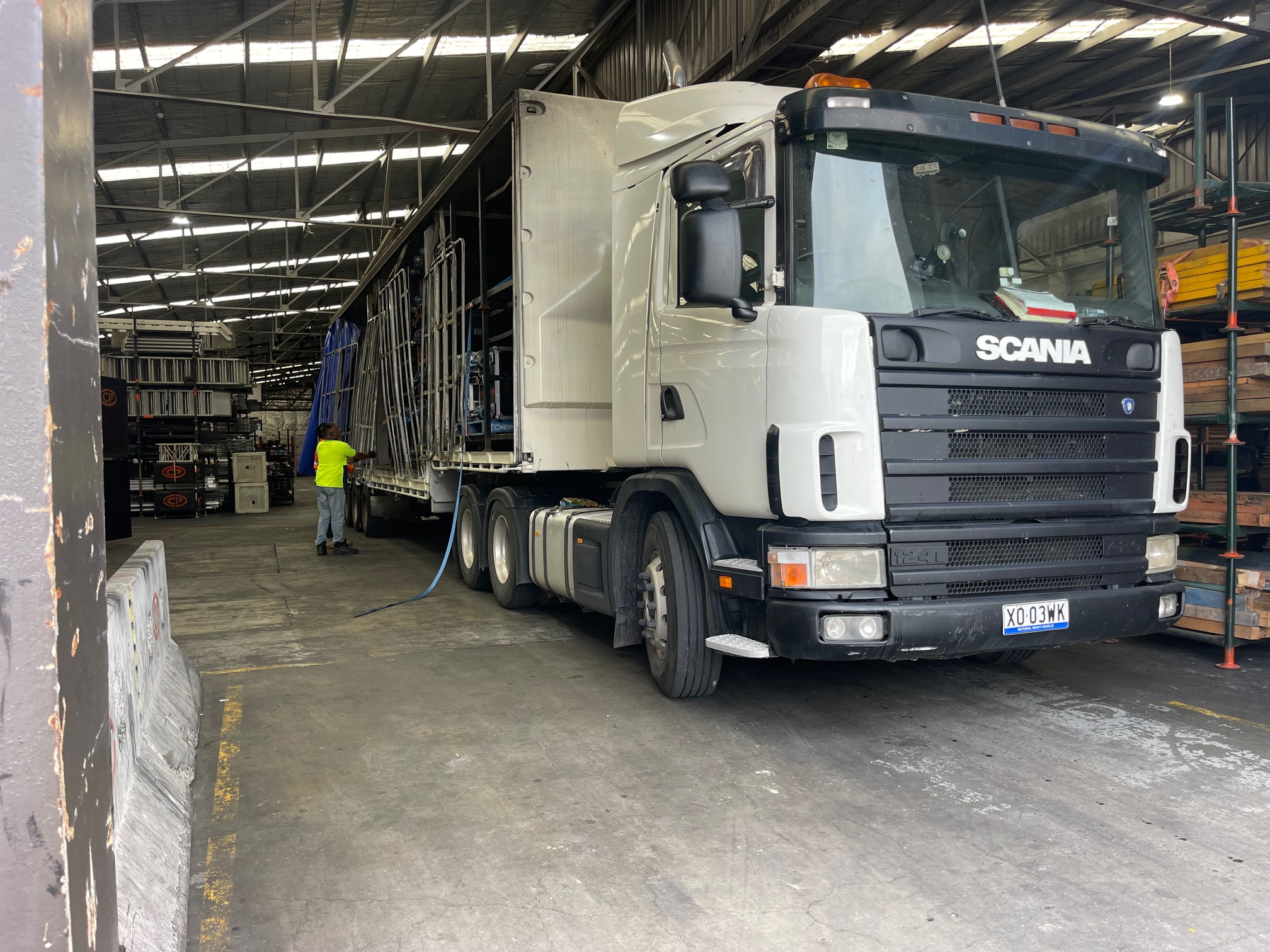 Quick Cargo semi trailer truck in the process of being loaded for same day interstate freight transport